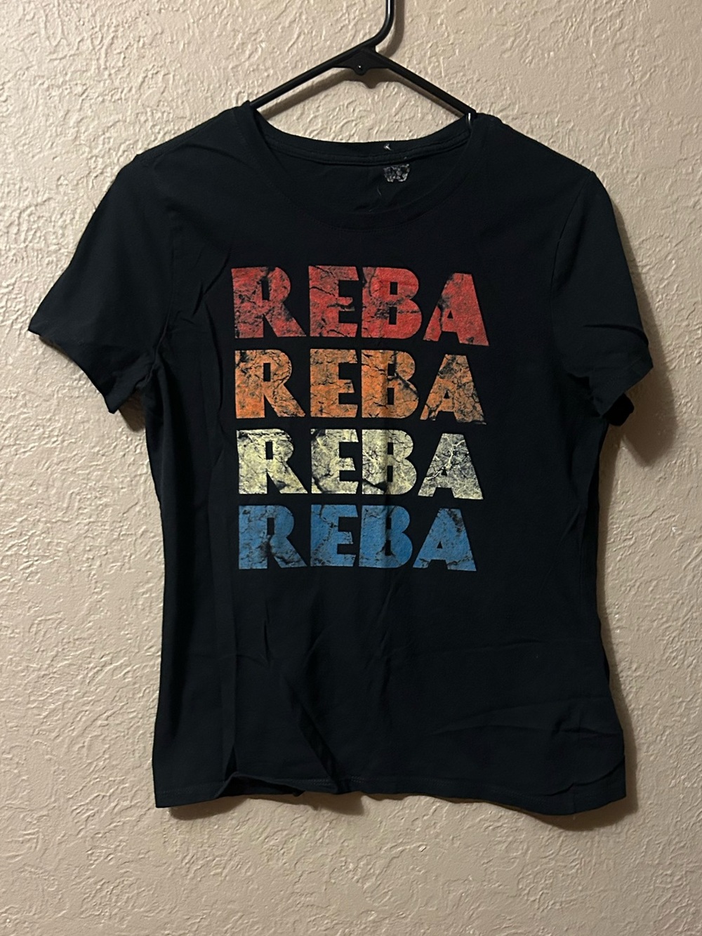 REBA Black Short Sleeve Tee with Multicolor Stacked Logo